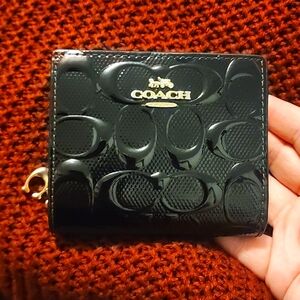 Coach snap wallet in signature leather.
